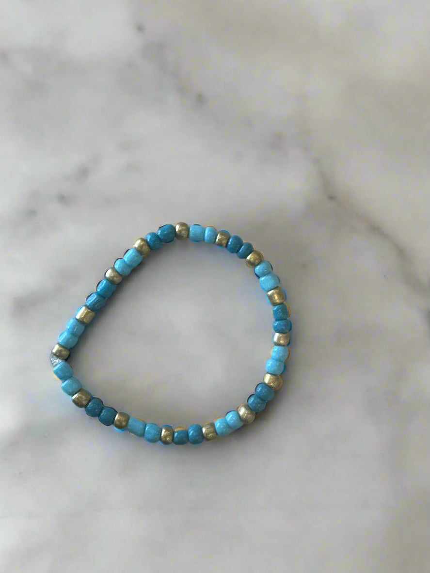 dark and light blue bracelet with gold accents