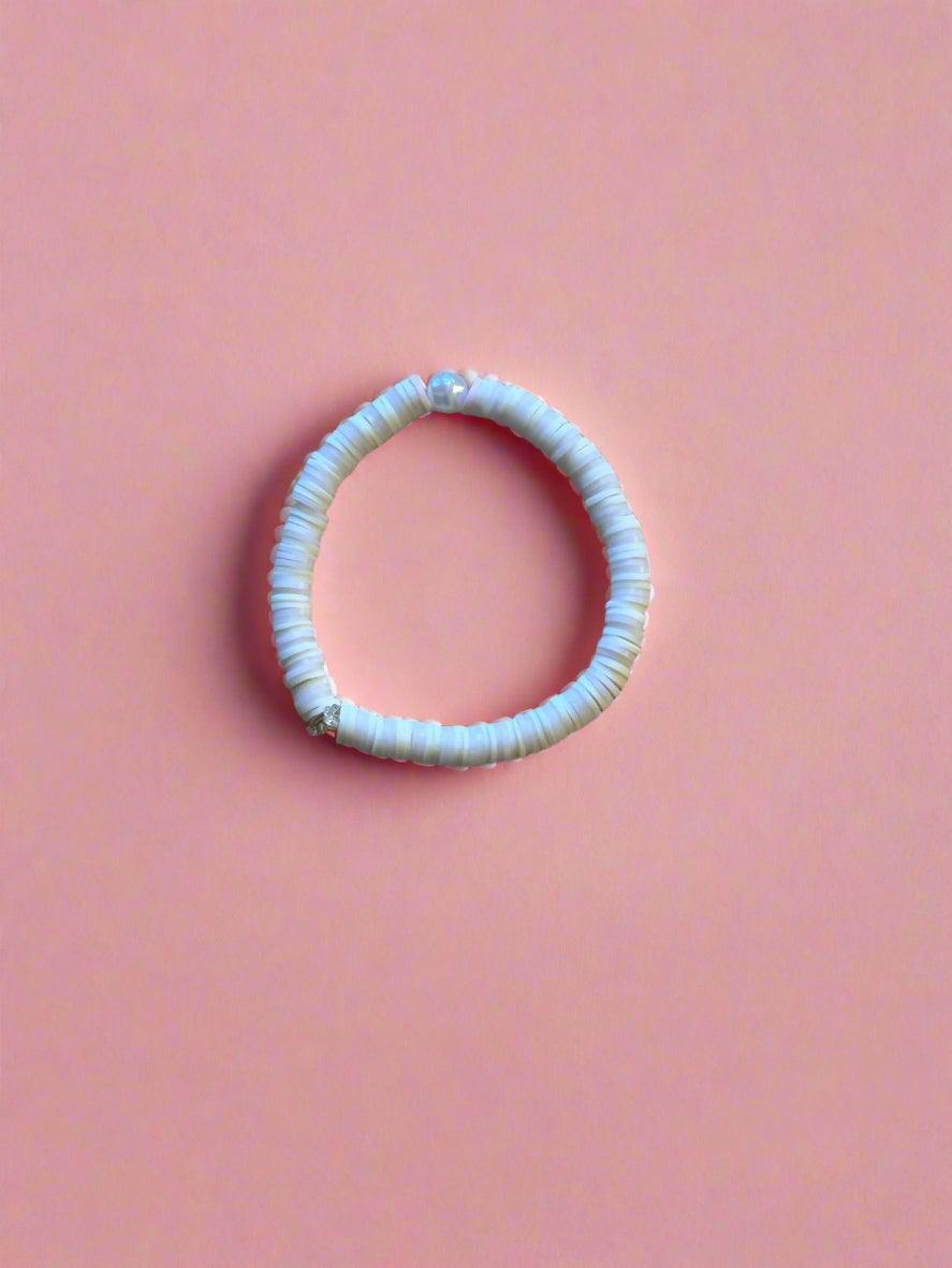 white bracelet with subtle pink accents